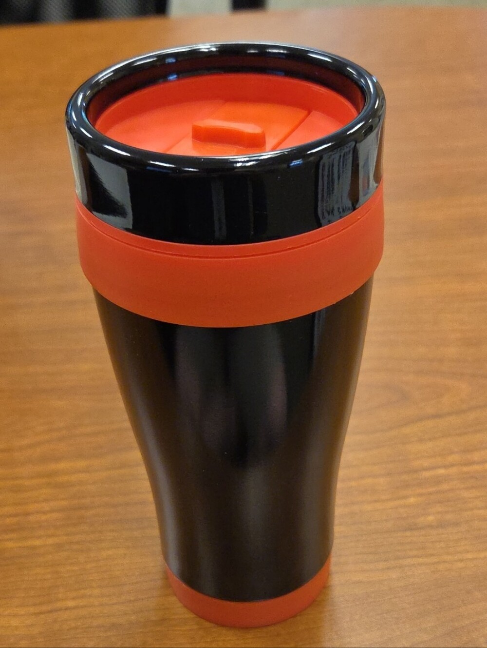 Liquid Logic: 16oz Black Travel Tumbler with Orange Accents